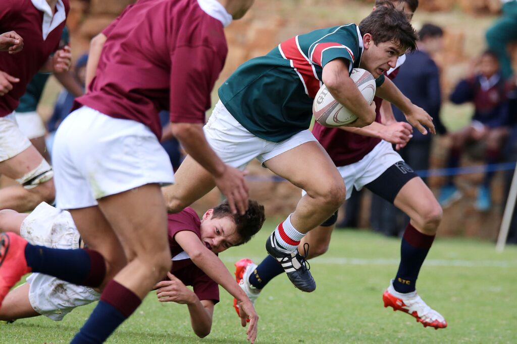 pexels-photo-3624737-3624737 Intense rugby match with players in action, showcasing strength and teamwork.